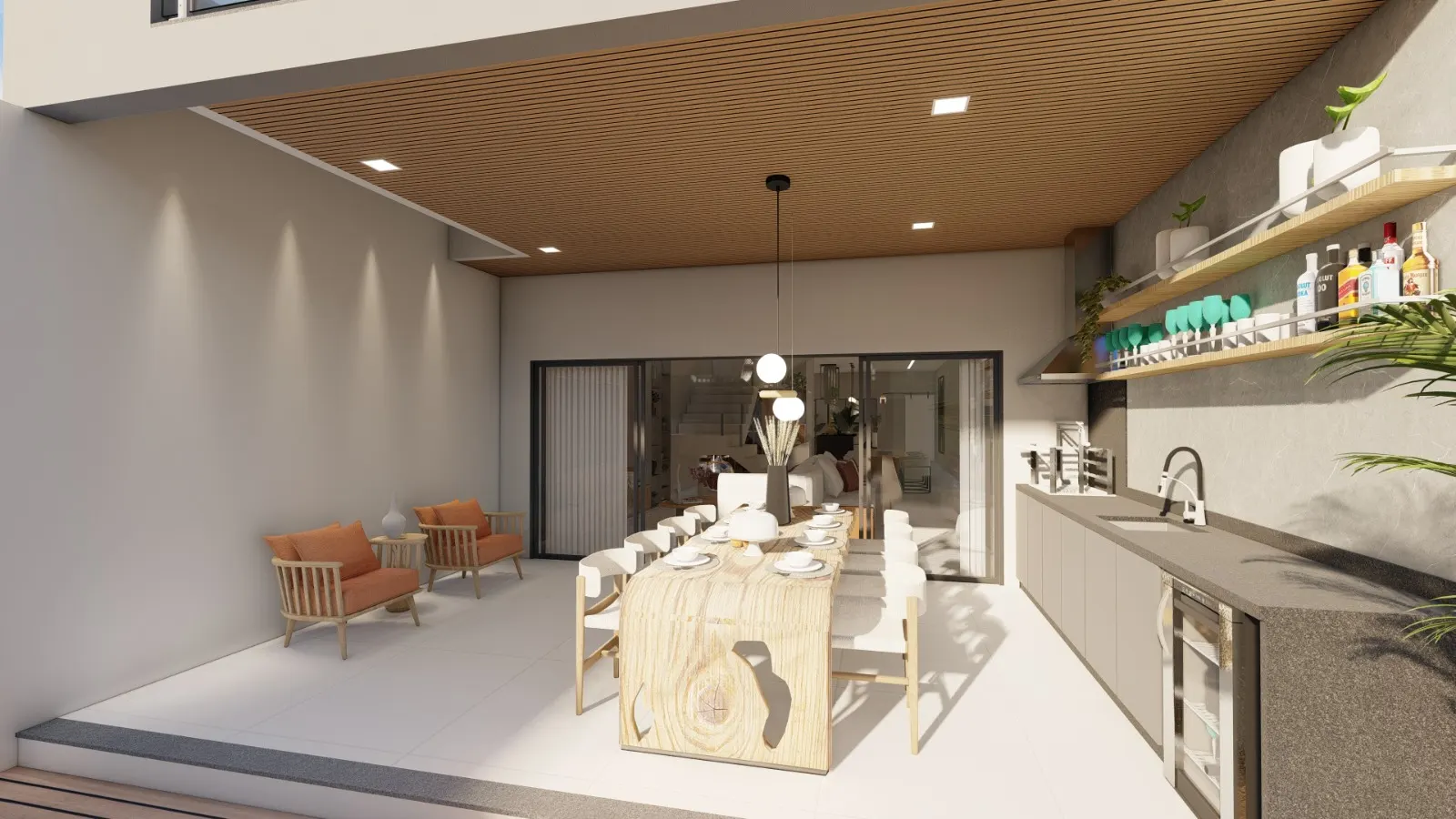 Área gourmet com forro de madeira, mesa de jantar e cozinha externa integrada ao jardim
